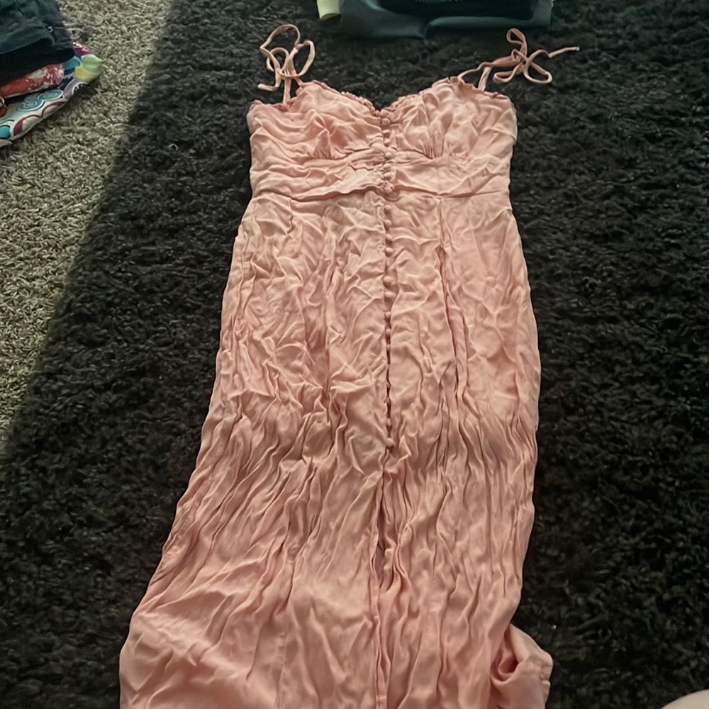 Peach dress, zipper in back, button detail.